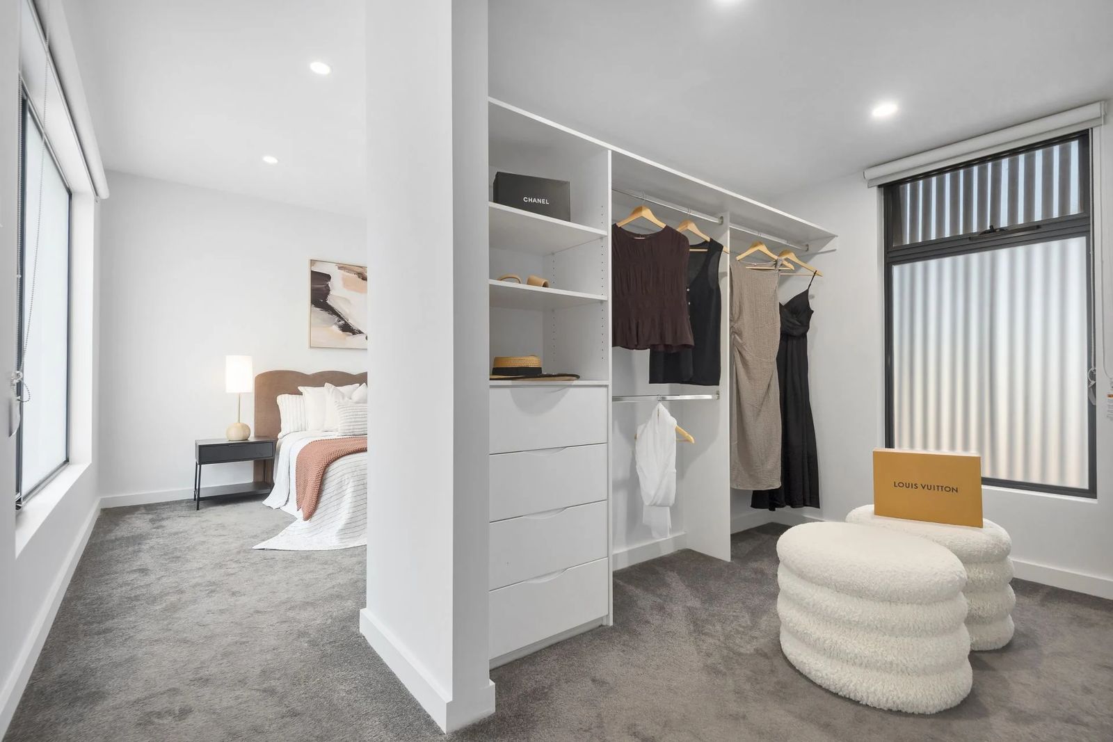 Bedroom and walk-in robe in a medium density townhouse by Zentos Constructions